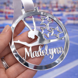 Load image into Gallery viewer, silver mirror acrylic personalised gymnastics medal held in hand with custom name design