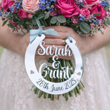 Load image into Gallery viewer, Personalised silver mirror wedding horseshoe hanging from bridal bouquet engraved Sarah & Grant 28th June 2025