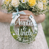 Load image into Gallery viewer, Silver mirror personalised wedding horseshoe engraved Auntie & Uncle 7th June 2025 hanging from yellow and white bridal bouquet