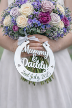 Load image into Gallery viewer, Personalised silver mirror wedding horseshoe gift for bride engraved Mummy & Daddy 2nd July 2025 hanging from bouquet