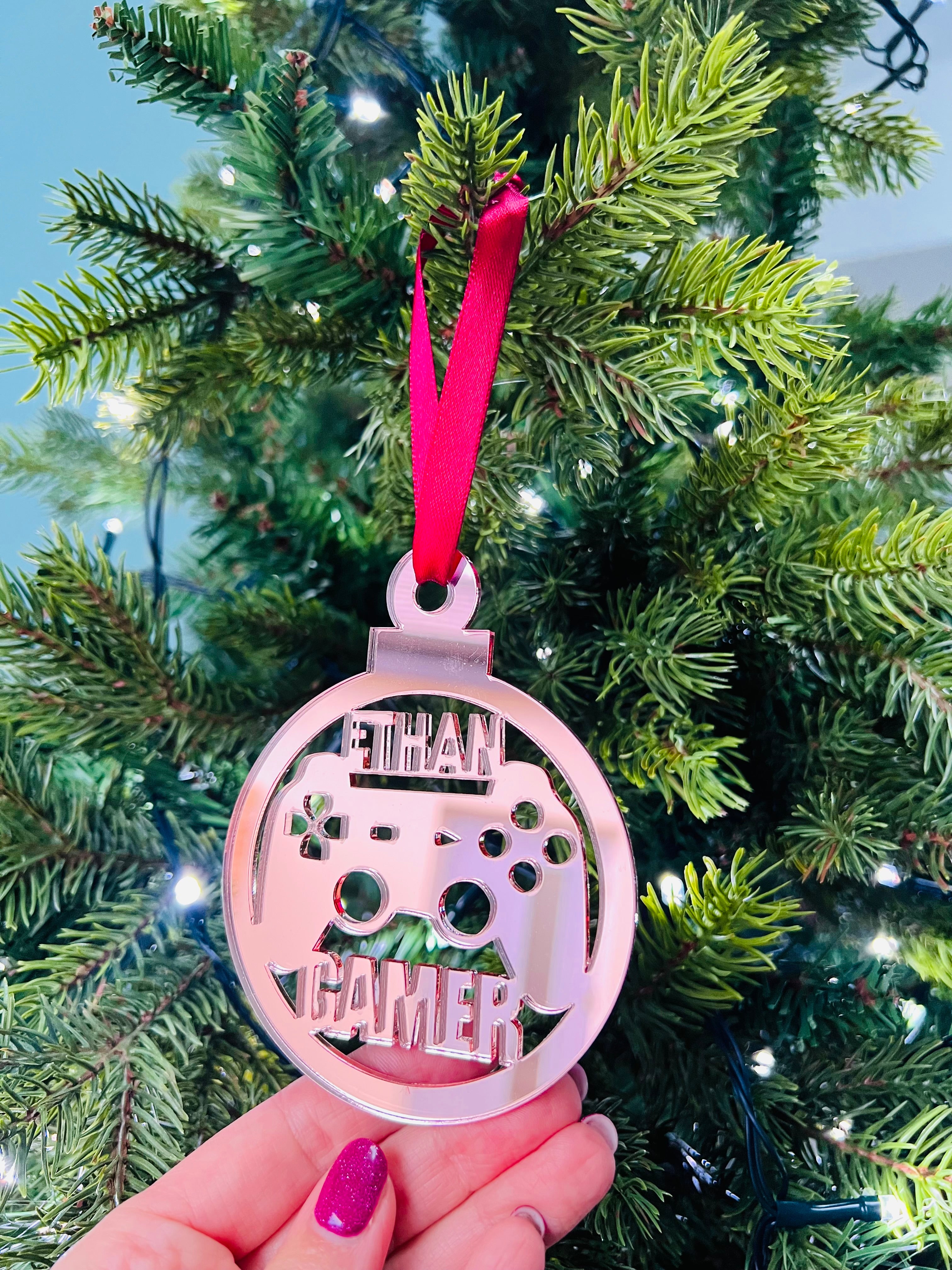 Load image into Gallery viewer, A hand holding a pink Christmas tree decoration with 'Gamer' text and a game controller shape.

