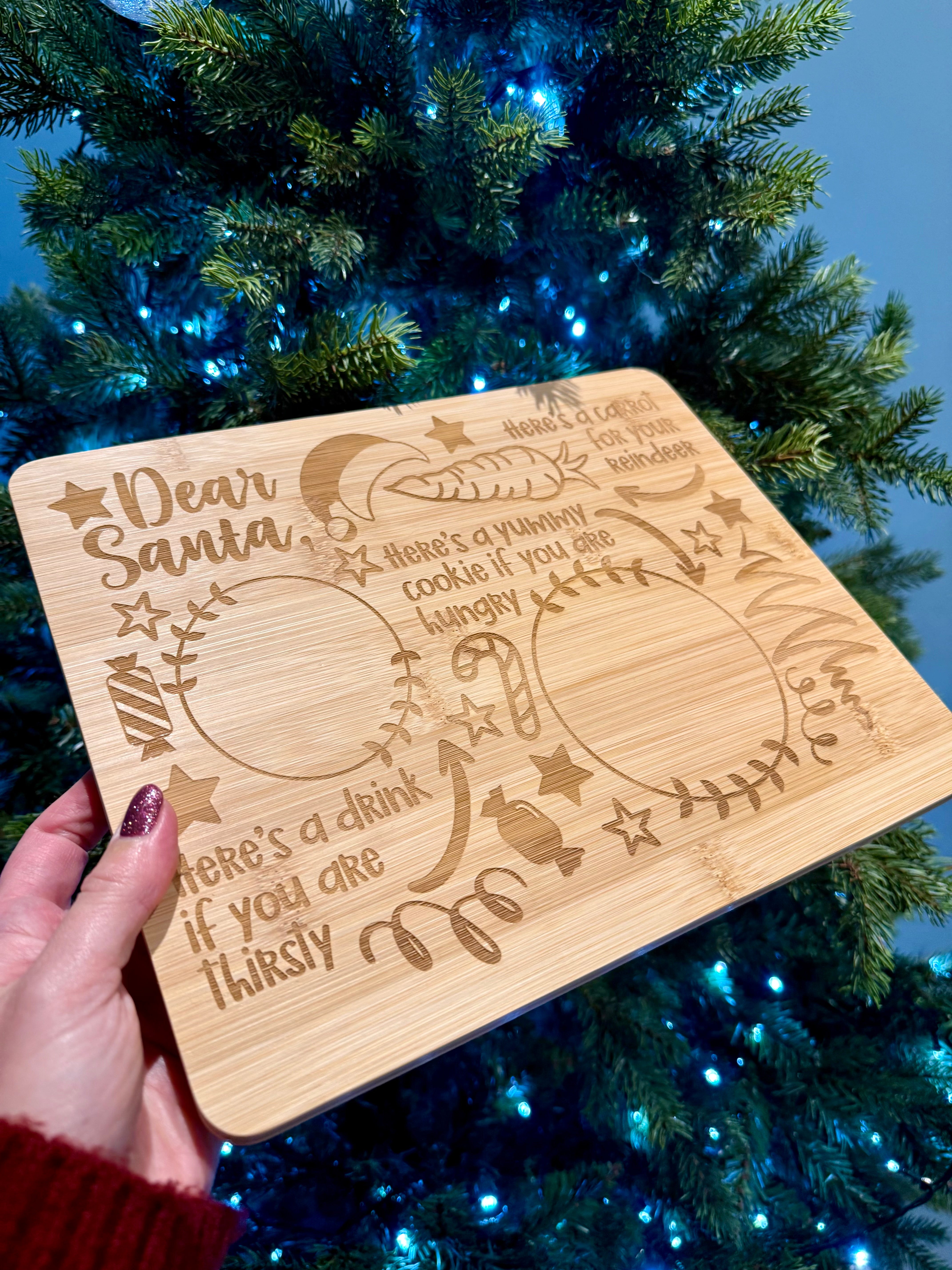 Load image into Gallery viewer, Wooden plaque with engraved text in front of a decorated Christmas tree
