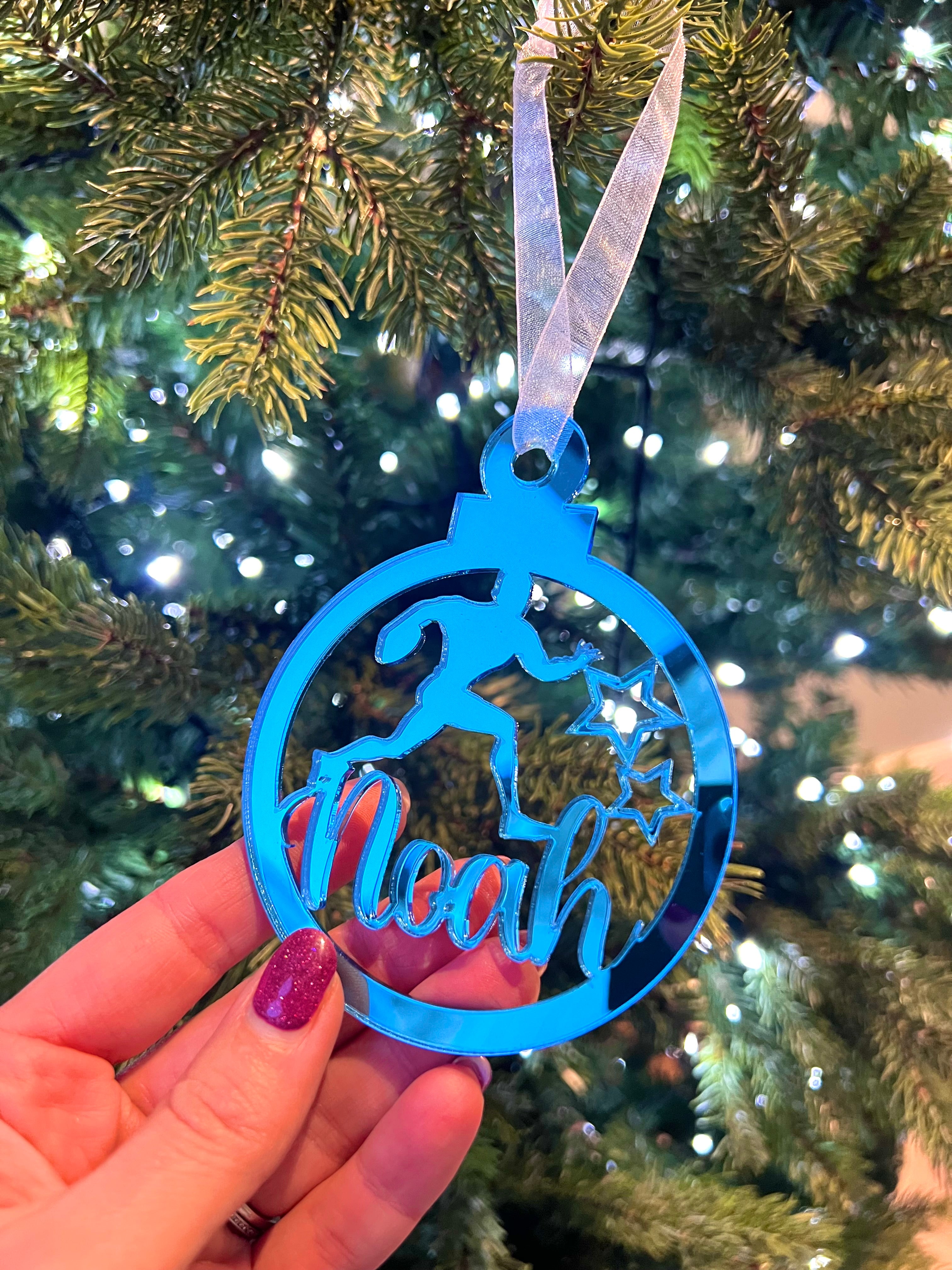 Load image into Gallery viewer, Blue ornament with 'Noah' on a Christmas tree
