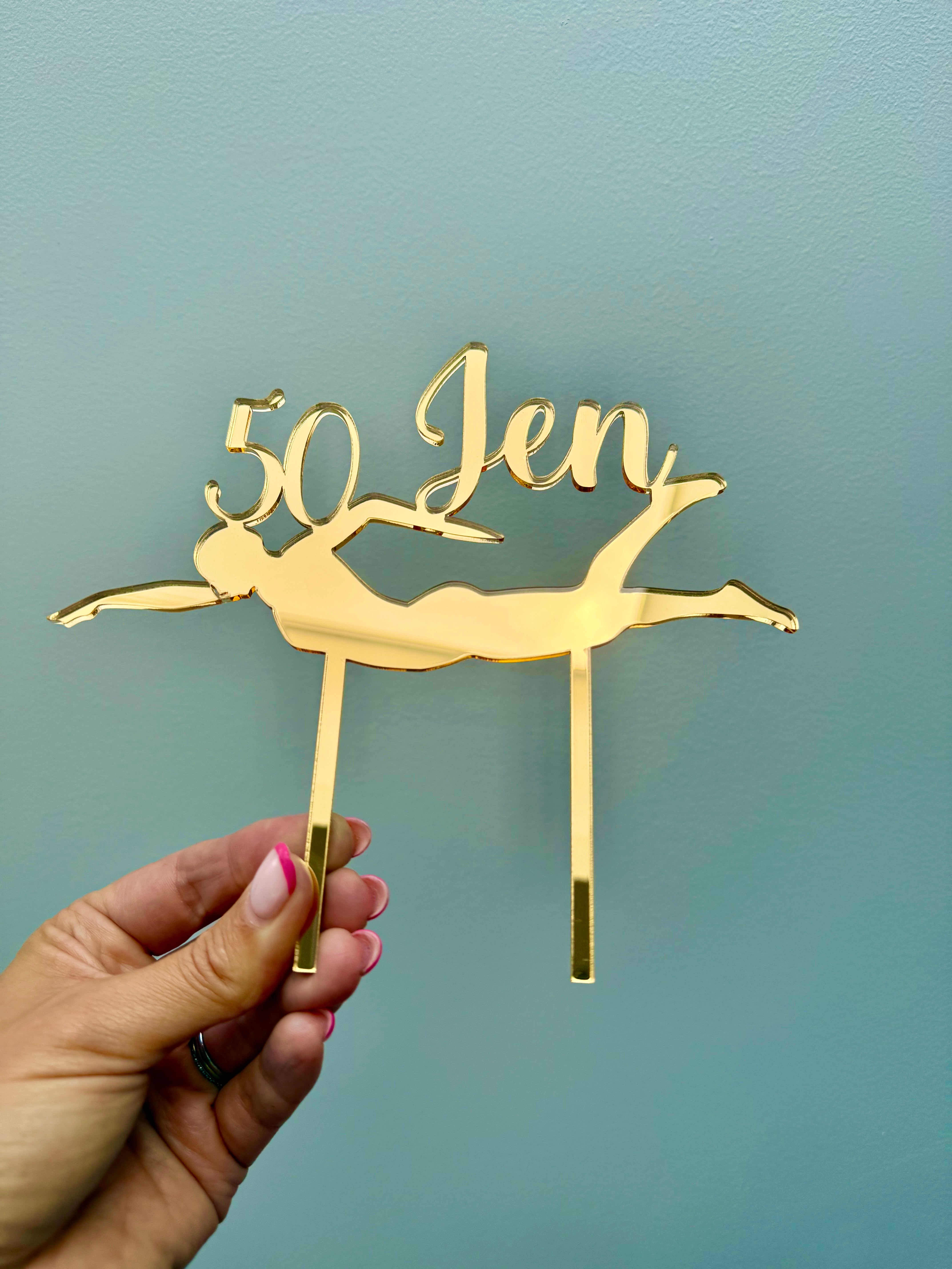 Load image into Gallery viewer, Personalised swimming birthday cake topper with custom name and age displayed on a celebration cake.
