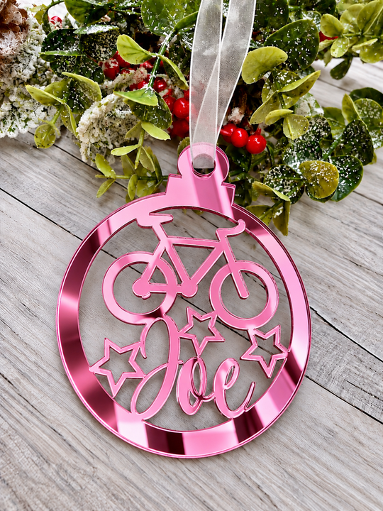 Personalised cyclist Christmas decoration in pink mirrored acrylic