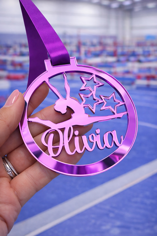 purple mirror acrylic personalised gymnastics medal held in hand with custom name design