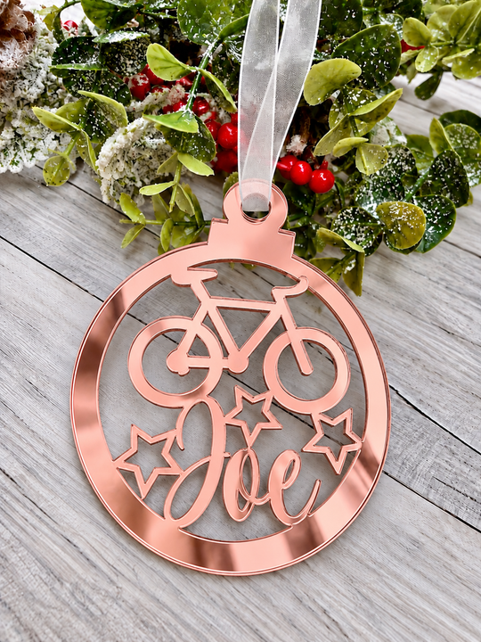 Personalised cyclist Christmas decoration in rose gold mirrored acrylic