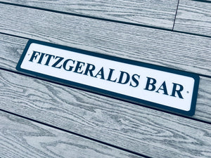 Personalised bar name sign mounted on outdoor wall, perfect for home bar, man cave, or garden pub decor