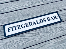 Load image into Gallery viewer, Personalised bar name sign mounted on outdoor wall, perfect for home bar, man cave, or garden pub decor
