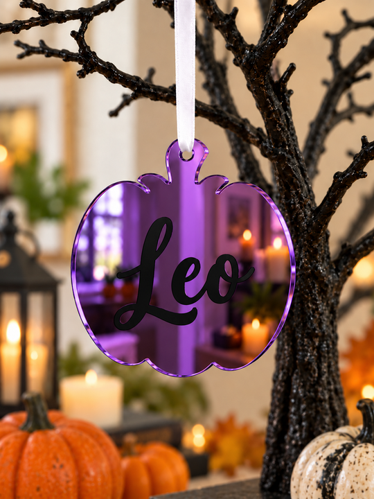 Personalised pumpkin Halloween tree decoration in purple mirrored acrylic with the name in black