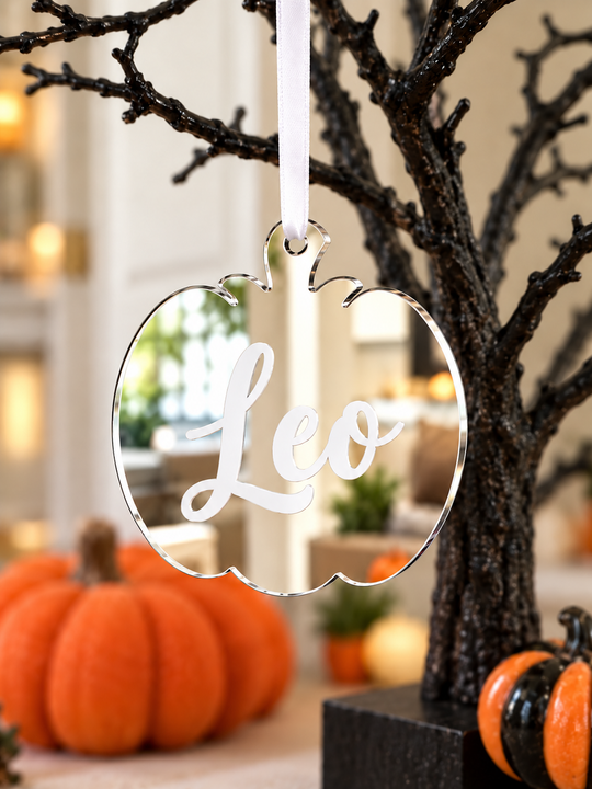 Personalised pumpkin Halloween tree decoration in silver mirrored acrylic with the name in white