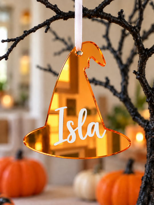 Personalised witch hat Halloween tree decoration in orange mirrored acrylic with the name in white